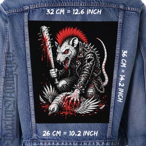 May include: A blue denim jacket featuring a large rectangular back patch with a graphic of a rat with a red mohawk, wearing a studded leather jacket, holding a bloodied spiked baseball bat over a bird. Dimensions are 32 cm by 36 cm.