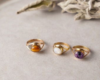 Delicate brass rings with various stones, golden boho jewelry