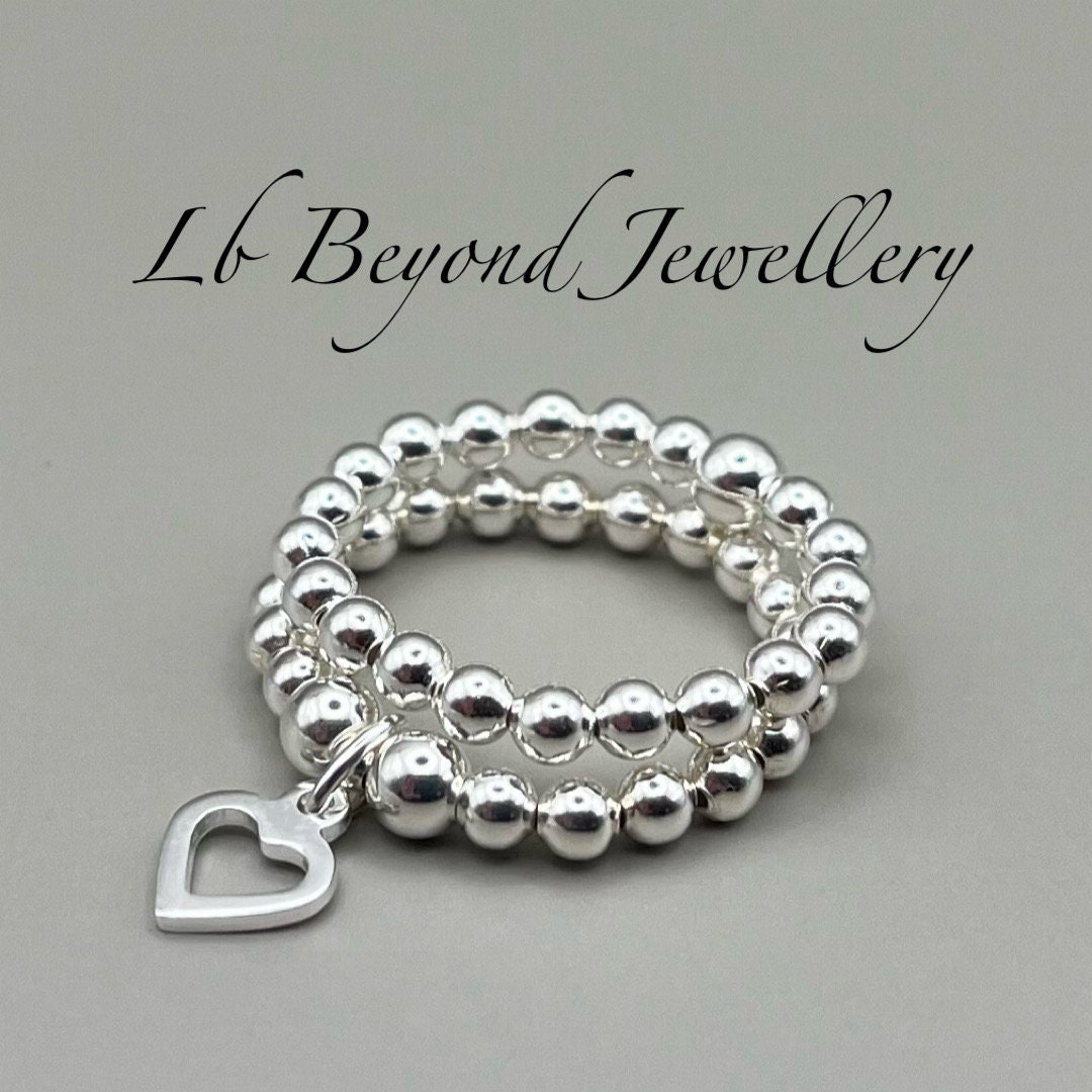 Sterling Silver Beaded Stretch Stacking Rings With Open Heart Charm Set ...