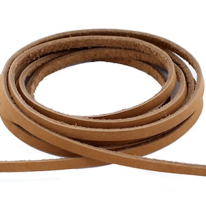 Könnte beinhalten: Eine Spule mit braunem Lederband, etwa 5 mm breit, perfekt für Bastelprojekte.