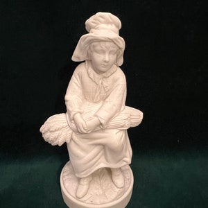Figurina vintage del ragazzo del villaggio