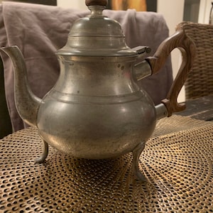 Pewter coffee or tea pot by Kirk Stieff of the Stieff Co., in the Colonial Williamsburg pattern