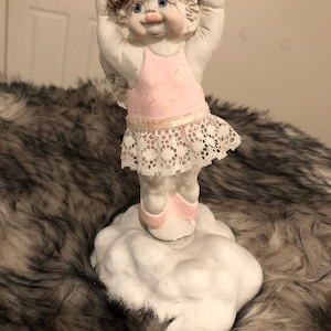 Dreamsicle Ballerina Music Box, Dancing on clouds