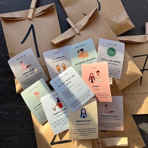 May include: A set of colorful cards with illustrations and text in Arabic and German. The cards feature Islamic themes and concepts, such as the five pillars of Islam, the Shahada, and the meaning of halal and haram. The cards are arranged on brown paper bags with numbers written on them.