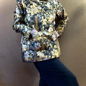 Elegant floral evening coat for women in lightweight metallic, large stand up collar, formal dress coat. Stylish special occasion attire.