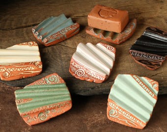 Small, wavy ceramic soap dish made of red clay. Unique pieces with stamped patterns in various colors. Soap dish "small dry wave".