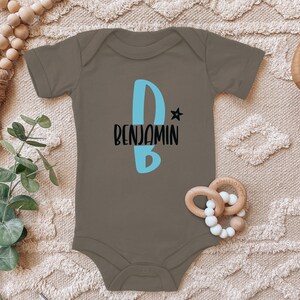 Body de bebé cigüeña azul con nombre personalizado letra inicial estrella regalo para niño pequeño algodón orgánico de manga corta