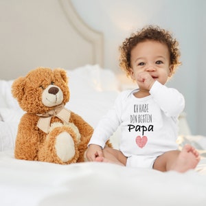 Body de bebé Cigüeña azul &quot;Tengo el mejor papá&quot; Regalo de corazón para el nacimiento en el cumpleaños para niño pequeño Algodón orgánico de manga larga