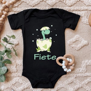Baby Body "Baby Dini, dinosaur hatches from the egg, personalized with desired name" saying gift for birth for birthday cotton