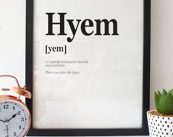 May include: Black and white framed print with the word "Hyem" in bold, followed by the phonetic pronunciation in brackets, "[yem]". The text below defines "Hyem" as a Geordie word for "home" and includes the phrase "There's nee place like hyem."