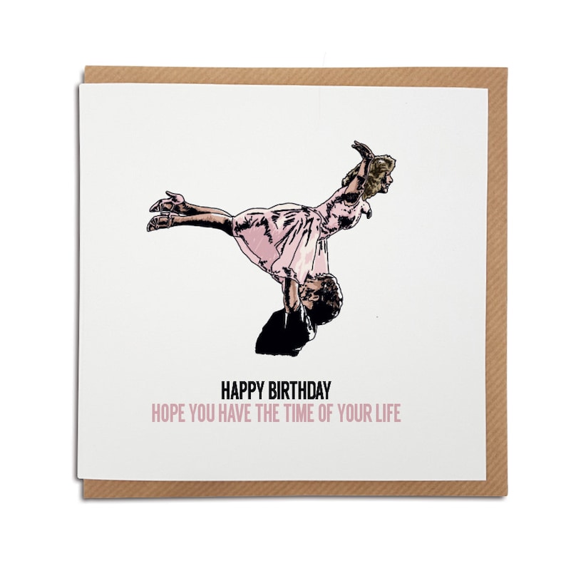 May include: A birthday card with a black and white illustration of a couple dancing. The woman is wearing a pink dress and is being lifted up by the man. The text on the card reads "Happy Birthday Hope you have the time of your life."