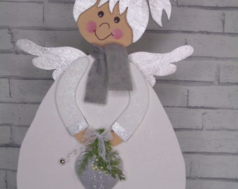 Wooden angels in white and silver Christmas decoration wooden figures