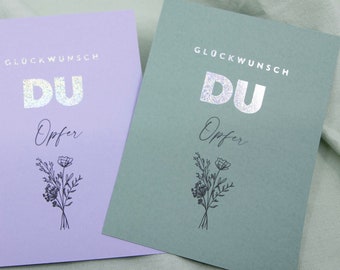 Postkarte Spruch Glückwunsch Du Opfer, mit Prägung in Gold, Silber, Holografisch Postkarte A6