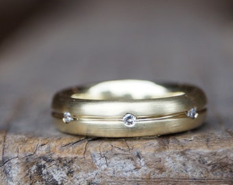 Partnerring "endlos" Gelbgold 585/-, 7 Brillanten