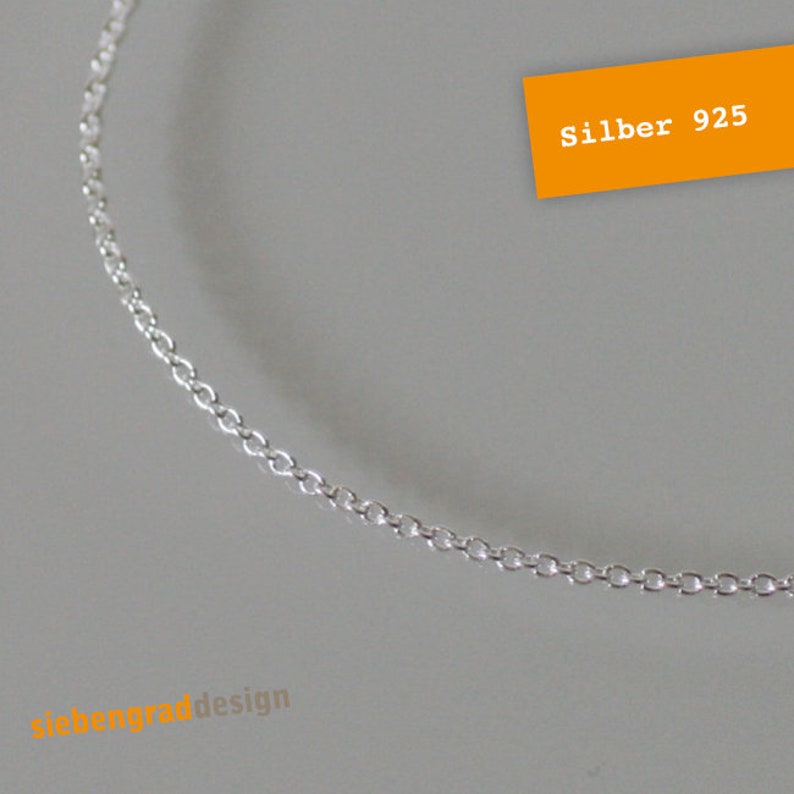 May include: A silver chain necklace made of 925 sterling silver. The chain is a delicate, simple design.