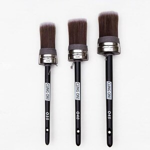 May include: Three black-handled paint brushes with silver ferrules and white bristles. The brushes are labeled "CLING ON!" and have size numbers 035, 040, and 045.