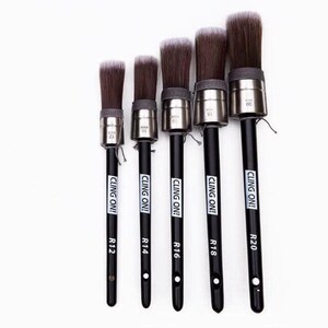 May include: Five black-handled paint brushes with silver ferrules and white bristles. The brushes are labeled "CLING ON!" and have sizes R12, R14, R16, R18, and R20.