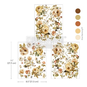May include: Floral design transfers featuring large yellow and peach roses with green leaves and small flowers. The transfers are 11 inches (27.9 cm) tall and 8.5 inches (21.5 cm) wide. The design includes bees and the text "Hue Harmony".