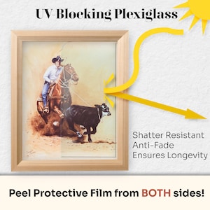 May include: A framed picture of a cowboy roping a calf, protected by UV-blocking plexiglass. The plexiglass is shatter resistant, anti-fade, and ensures longevity. Peel the protective film from both sides.