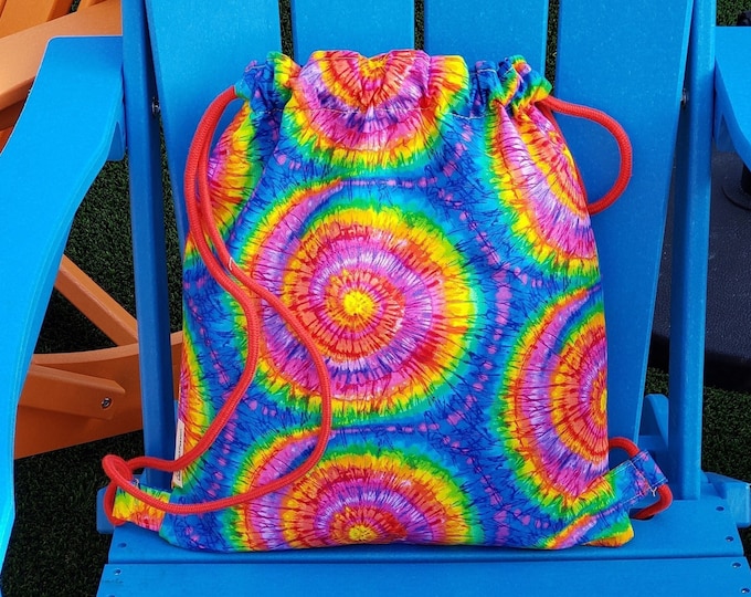 Tie-dye summer. Music festival ready with a colorful drawstring bag. Retro-inspired and Hippie chic.