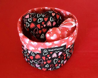Share the love: a happy anniversary gift set, a basket, and two heart ornaments.