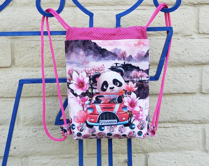 A Panda Bear backpack for kids, a red sports car, and pink Lotus flowers.