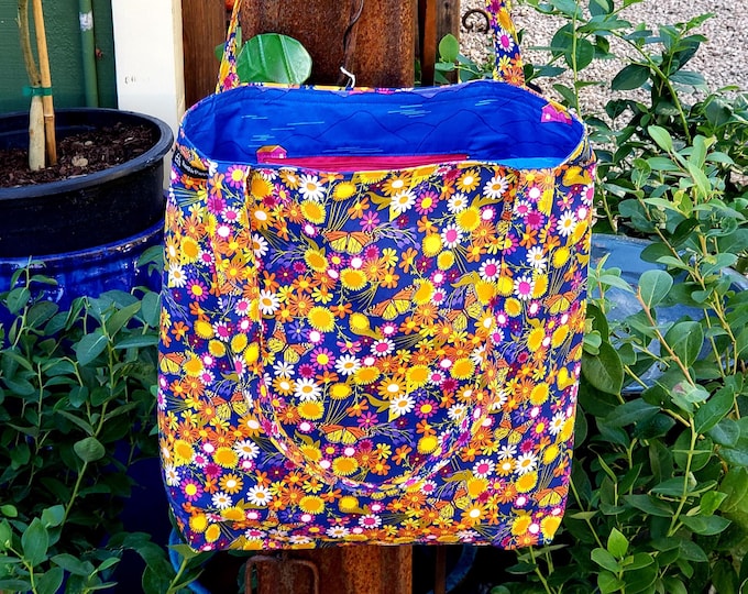 Summer bloom bag with mesmerizing wildflowers, butterflies, and a blue sky.