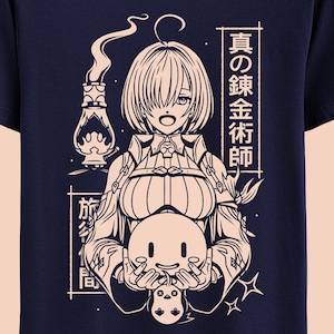May include: A navy blue t-shirt with a white outline illustration of a female anime character holding a small, round creature. The character has long, flowing hair and is wearing a detailed outfit. The text "真の黄金侍師" is written in Japanese on the right side of the shirt.