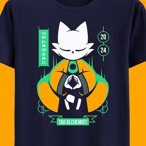 May include: A navy blue t-shirt with a graphic of a white cat meditating in a green and orange lotus position. The text "TAO ALCHEMIST" is printed below the cat. The numbers "20" and "24" are printed on the right side of the image.