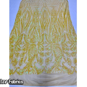 May include: Yellow iridescent sequin fabric with a floral pattern. The fabric has a sheer mesh backing.