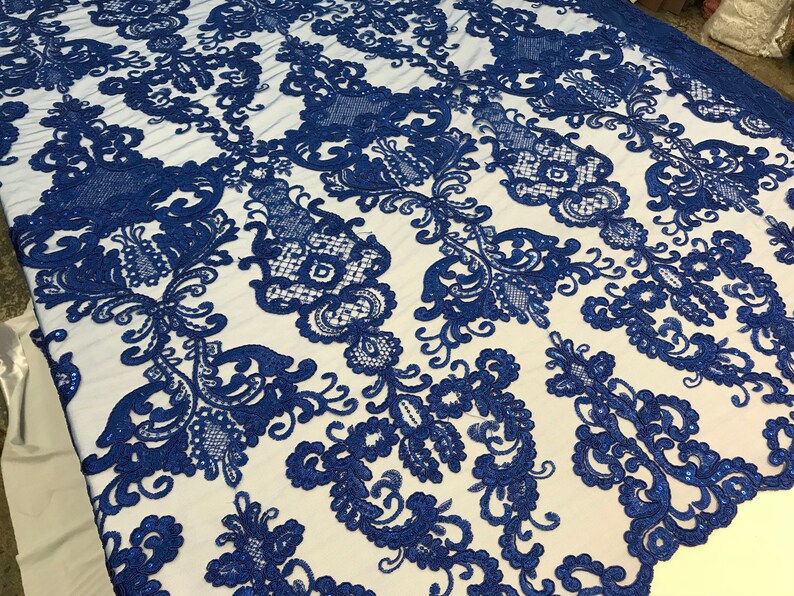Wings Design Embroider and heavy beading on a mesh lace-sold by the yard. Royal Blue