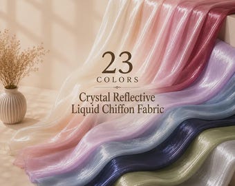 May include: Crystal reflective liquid chiffon fabric in a gradient of colors including cream, pink, purple, blue, and green. The fabric is draped in soft waves. Text on the image reads 23 COLORS Crystal Reflective Liquid Chiffon Fabric.