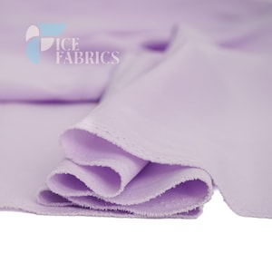 May include: A length of solid light purple fabric with a soft texture and draped folds. The top left corner features a logo with the text ICE FABRICS in white letters, accompanied by a stylized graphic element in shades of blue and light gray.
