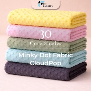 May include: A stack of five Minky Dot Fabric CloudPop blankets in various colors: yellow, pink, green, light blue, and dark purple. The text "30 Core Shades" is visible on the image.