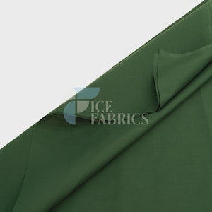 May include: A solid dark forest green fabric draped diagonally across the frame. The material has a smooth, matte texture and a consistent deep green colour throughout. A semi-transparent logo with the text ICE FABRICS is visible on the fabric.