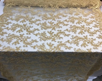 May include: Gold beaded lace fabric with a delicate floral pattern. The lace is on a sheer mesh background.
