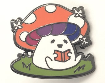 May include: A white mushroom character with a purple and blue cap, sitting on a green patch of grass, reading a red book. The mushroom has a white face with a happy expression and is wearing a red and white spotted mushroom cap.