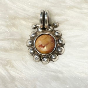 Spiny oyster and silver pendant