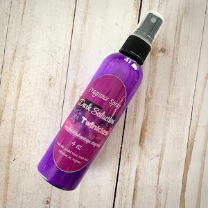 May include: Purple 4 oz bottle of Dark Seduction fragrance spray by Twinkles. The label says "Fragrance Spray Dark Seduction Twinkles www.twinklesboutique.etsy.com 4 oz Made with distilled water, witch hazel, fragrance 20."