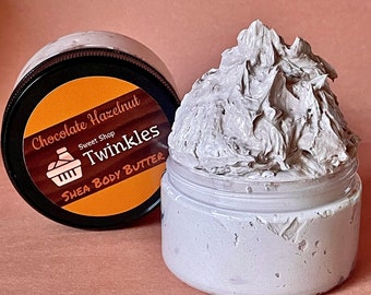 May include: A jar of Chocolate Hazelnut Shea Body Butter with a brown label that says "Sweet Shop Twinkles Shea Body Butter".