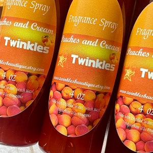 May include: Three 4 ounce bottles of peach and cream scented fragrance spray. The bottles are labeled "Fragrance Spray Peaches and Cream Twinkles" and include the website address "www.twinklesbeautique.etsy.com". The bottles are filled with a red liquid and have a peach and cream colored label with a star and peaches.