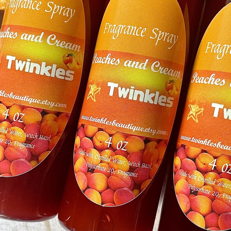 May include: Three 4 ounce bottles of peach and cream scented fragrance spray. The bottles are labeled "Fragrance Spray Peaches and Cream Twinkles" and include the website address "www.twinklesbeautique.etsy.com". The bottles are filled with a red liquid and have a peach and cream colored label with a star and peaches.