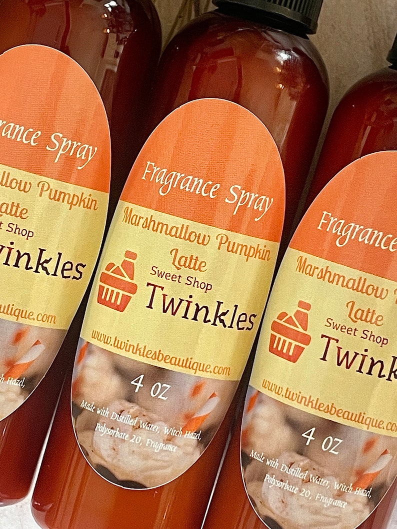 May include: Three 4 ounce bottles of fragrance spray with orange labels. The labels say "Fragrance Spray", "Marshmallow Pumpkin Latte", "Sweet Shop", "Twinkles", and "www.twinklesbeautique.com". The bottles are made with distilled water, witch hazel, polysorbate 20, and fragrance.