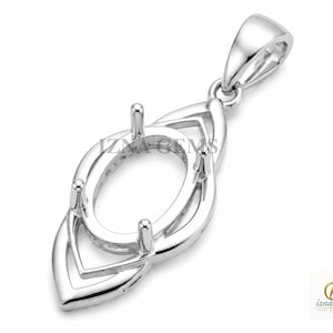 May include: A silver-toned metal pendant setting featuring an oval-shaped center mount with four prongs for a gemstone. The design includes an elongated, pointed frame with a bail at the top. The text IZNA GEMS is visible across the center.