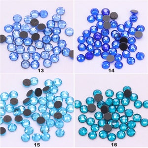 May include: Assortment of four colors of rhinestones, each color in a separate square. The colors are light blue, dark blue, turquoise, and teal. Each square has a number underneath, 13, 14, 15, and 16.