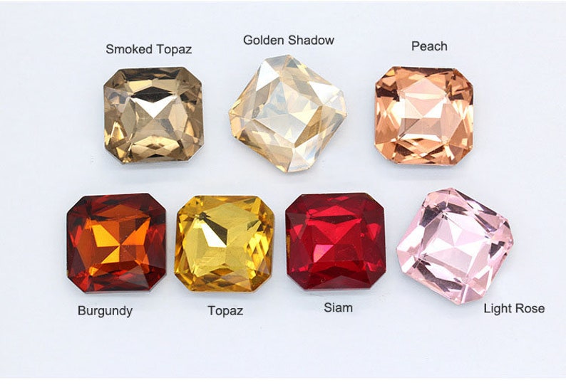 May include: Assortment of eight square-shaped glass rhinestones in various colors, including smoked topaz, golden shadow, peach, burgundy, topaz, siam, and light rose.