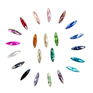 May include: Assortment of colorful marquise-shaped rhinestones in various colors, including pink, red, orange, yellow, green, blue, and purple.