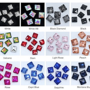 May include: Assortment of square-shaped rhinestones in various colours, including white, black, red, pink, peach, green, blue, and rose. The rhinestones are arranged in rows on a white background.