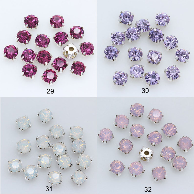 May include: Assortment of 20 round, flat-back rhinestones in four colors: fuchsia, lavender, white, and pink. The rhinestones are arranged in four groups of five, with each group labeled with a number from 29 to 32.