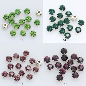 May include: Assortment of green, purple, and silver rhinestones. The rhinestones are arranged in groups of 12 to 15 on a white background. The rhinestones are approximately 6mm in diameter.